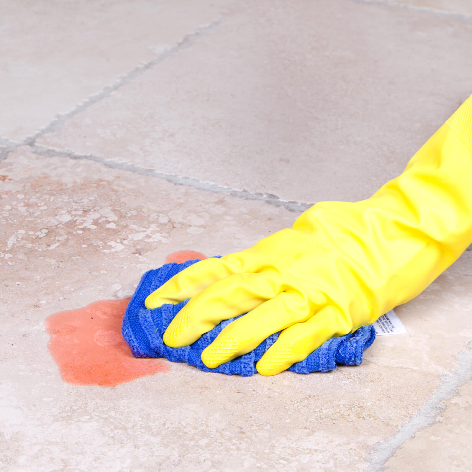 cleaning spill off of tile flooring | Gilman Floors